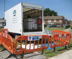 Oil receiving vehicle in position to be loaded to remove oil.